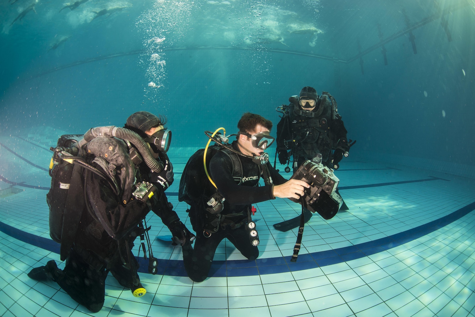Explosive Ordnance Disposal (EOD) technician 2nd Class Andrew Dixon, center, assigned to EOD Mobile Unit (EODMU) 1, demonstrates the functions of the UIS underwater sonar system to Republic of Korea Navy UDT/SEALs during Clear Horizon 2015 on Commander Fleet Activities Chinhae.  Exercise Clear Horizon is an annual bilateral exercise between the U.S. and Republic of Korea navies that focus on increasing capabilities and coordination between ships, and aircraft in mine countermeasures in international waters surrounding the Korean peninsula.   (U.S. Navy Combat Camera Photo by Mass Communication Specialist 2nd Class Daniel Rolston/RELEASED)