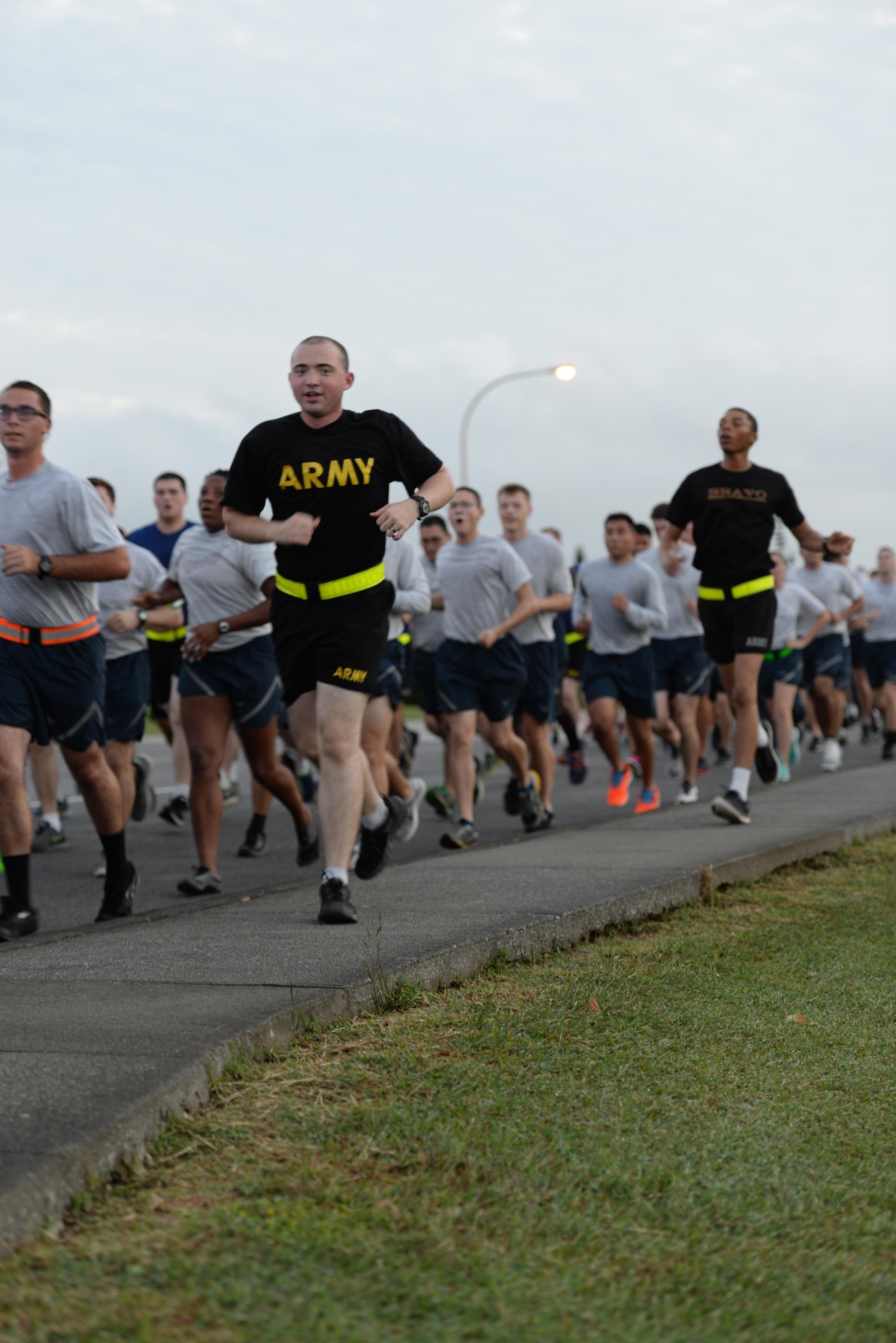 Team Kadena Airmen and Soldiers run together during an Army/Air Force 5K run Nov. 6, 2015, at Kadena Air Base, Japan. More than 500 runners turned out for the event, signifying strength and unity among sister services. (U.S. Air Force photo by Staff Sgt. Amber E. N. Jacobs/Released)