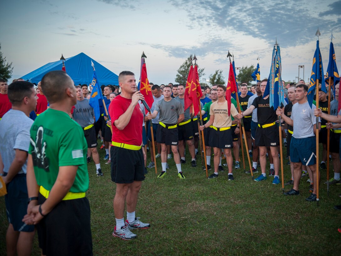 U.S. Army Lt. Col. Scott Dellinger, 1st Battalion 1st Air Defense Artillery Regimen commander, addresses the crowd after an Army/Air Force 5K run Nov. 6, 2015, at Kadena Air Base, Japan. The run was held to signify Team Kadena’s strength and interoperability among sister services. (U.S. Air Force photo by Master Sgt. Jason W. Edwards/Released)