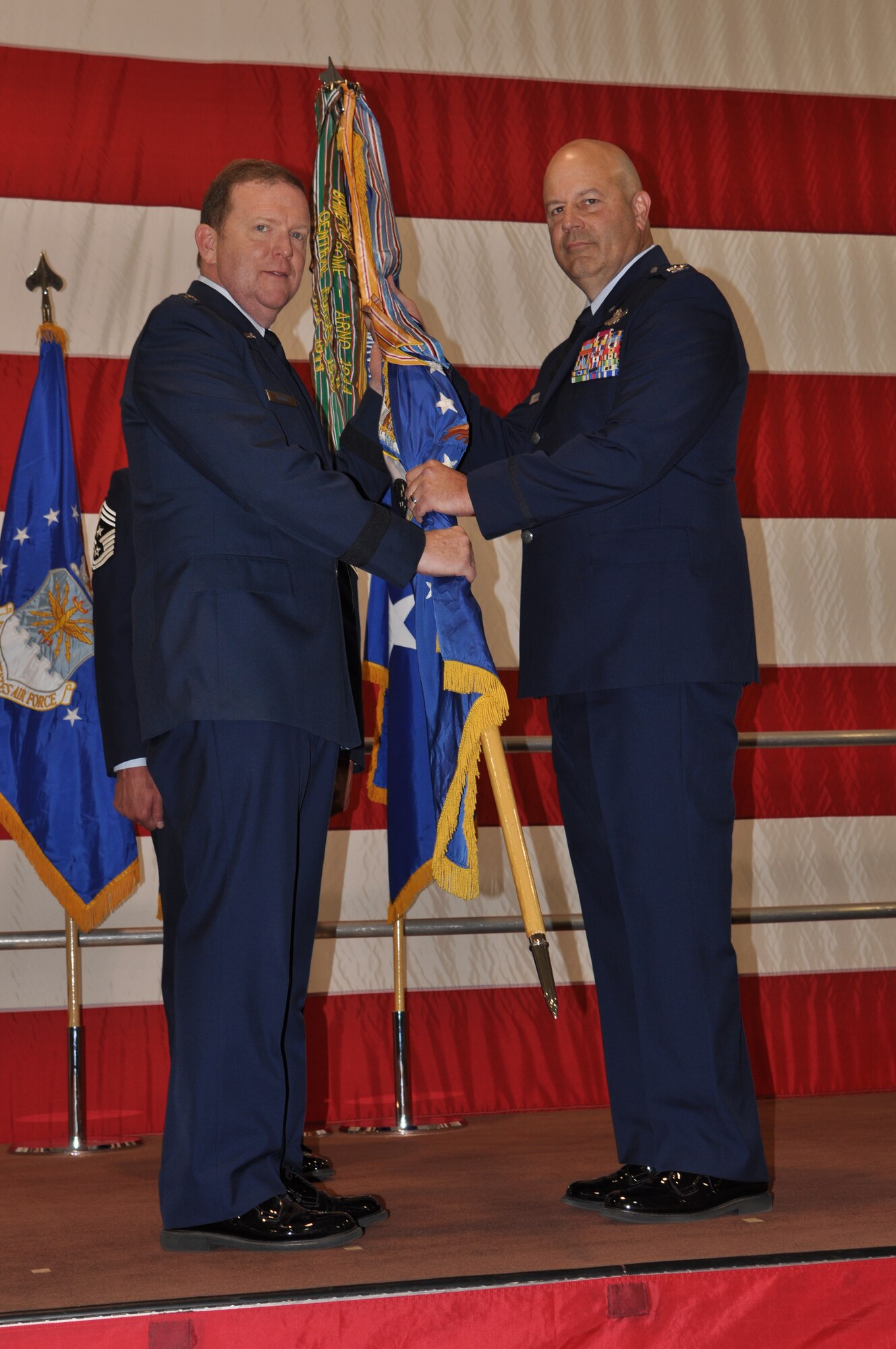 Col. Brian Borgen assumes command of the 442d Fighter Wing from Maj. Gen. Richard Scobee, 10 Air Force Commander, at a Change of Command ceremony here Nov. 8.  Borgen was the former 442d Operations Group commander and interim vice commander before taking the wing commander role. (U.S. Air Force photo by Capt. Denise Haeussler)