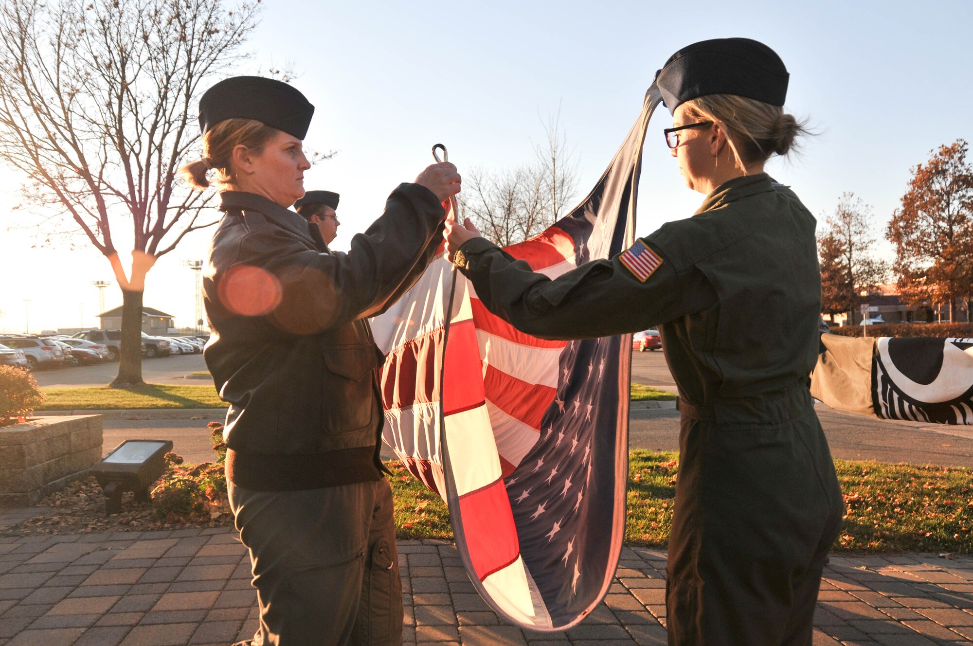 Master Sgt. Jodi Wortman, left, and Senior Airman Hannah Currie, aeromedical evacuation technicians with the 934th Aeromedical Evacuation Squadron, fold the American flag during a retreat ceremony Nov. 7 at the Minneapolis-St. Paul International Airport Air Reserve Station, Minn. (U.S. Air Force photo by Tech. Sgt. Cherish Chavez)