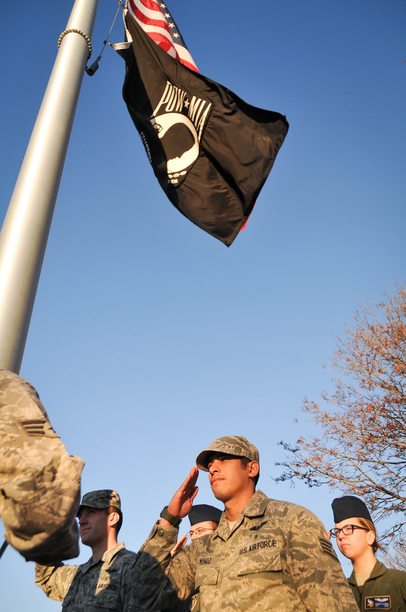 Members of the 934th Aeromedical Evacuation Squadron salute the flag during a retreat ceremony Nov. 7 at the Minneapolis-St. Paul International Airport Air Reserve Station, Minn. (U.S. Air Force photo by Tech. Sgt. Cherish Chavez)