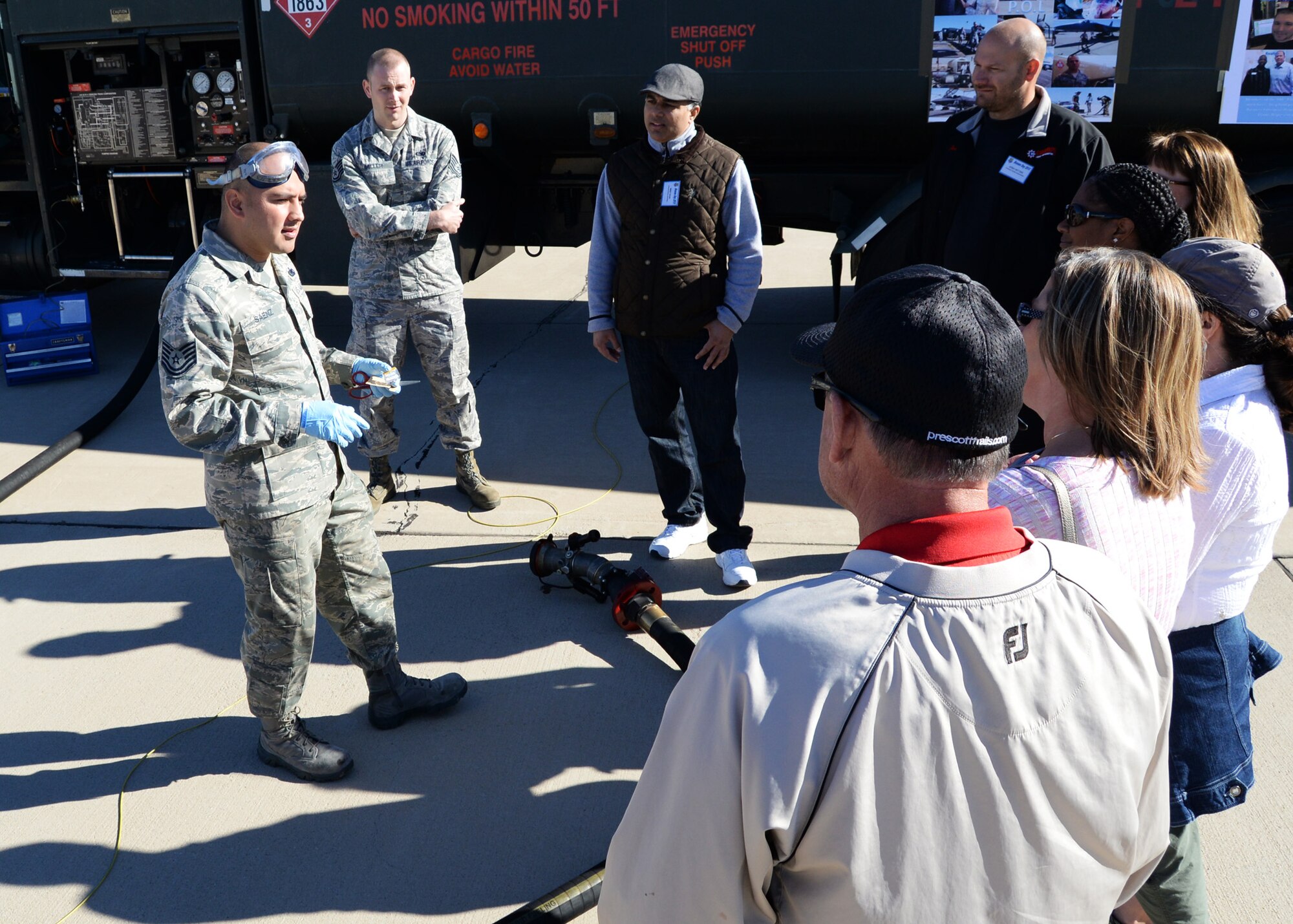 Tech. Sgt. Christopher Saenz, 944th Logistics Readiness Squadron fuels technician, briefs 944th Fighter Wing Airmen civilian employers on fueling aircraft during the Boss’s Day event Nov 7 at Luke Air Force Base, Ariz. (U.S. Air Force photo taken by Staff Sgt. Nestor Cruz)