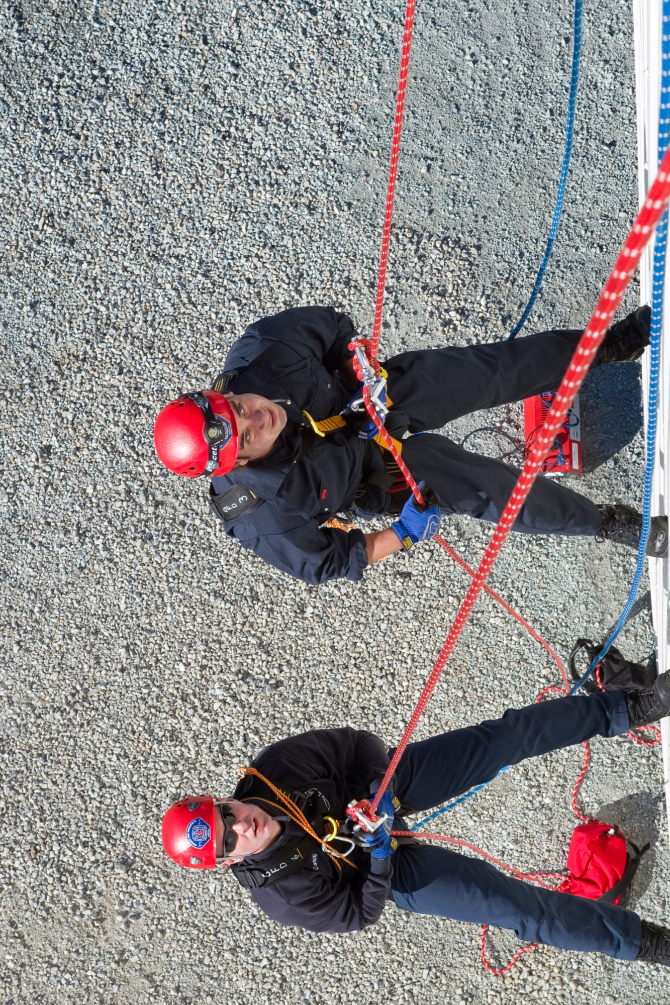 Thomas Carey, left, and Justin Morales, both Grissom Fire Department firefighters, rappel from a training tower on the newly renovated fire training facility at Grissom Air Reserve Base, Ind., Nov., 9, 2015. The new facility will help provide firefighters with mandated training requirements. (U.S. Air Force photo/Tech. Sgt. Benjamin Mota)