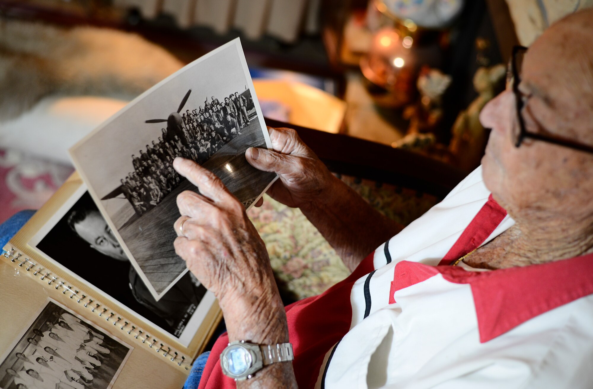 Retired Lt. Col. Clifton Ward, World War II and Vietnam combat pilot, explains details about a deployment photo during an interview at his home in Tampa, Fla., Oct. 28, 2015. Ward was stationed at MacDill Air Force Base from 1956 to 1959. After retirement in 1971 Ward and his family moved back to the Bay area and has lived there ever since. (U.S. Air Force photo by Tech. Sgt. Brandon Shapiro/Released)