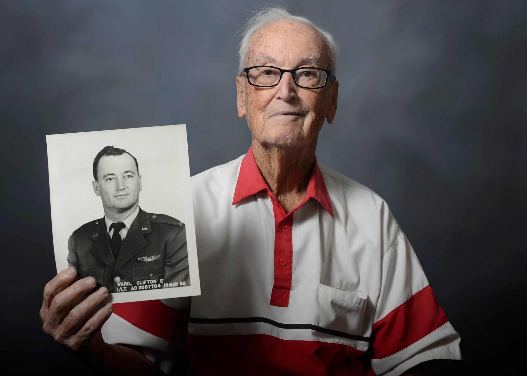 Retired Lt. Col. Clifton Ward, World War II and Vietnam combat pilot, shows his official photo taken on May 19, 1955 during a visit to MacDill Air Force Base, Fla., Nov. 5, 2015. During his illustrious flying career, Ward piloted 29 aircraft, was reported missing in action, and earned the Distinguished Flying Cross, the Bronze Star Medal, and an Air Medal for his actions in WWII and Vietnam. (U.S. Air Force photo by Tech. Sgt. Brandon Shapiro/Released)