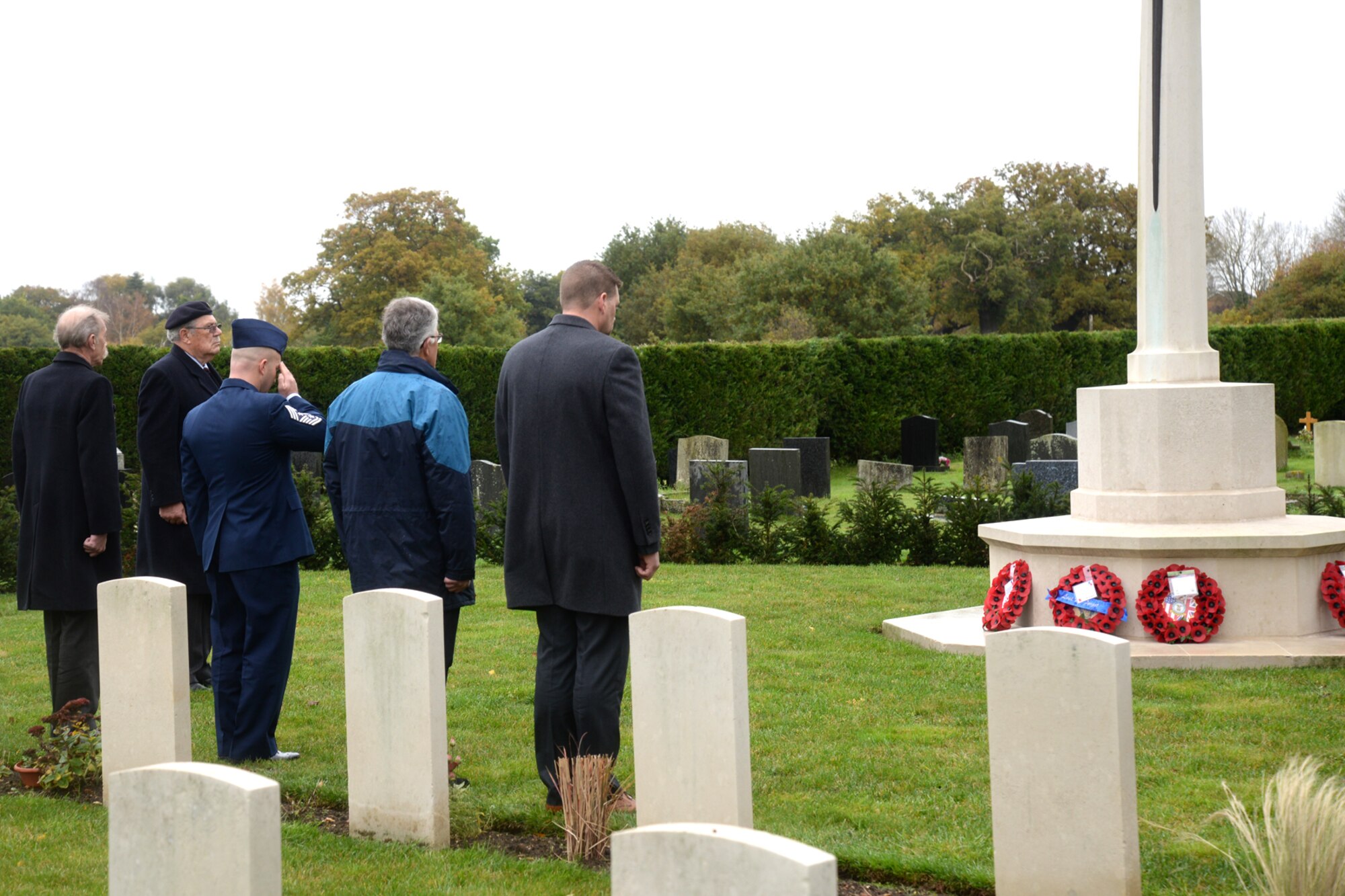 U.S. Air Force Chief Master Sgt. Anthony Cruz Munoz, 100th Air Refueling Wing command chief, represented RAF Mildenhall at the War Graves Memorial during a Remembrance Day ceremony Nov. 8, 2015, in Beck Row, Suffolk, England. Remembrance Day is held annually in November as a way to pay respect to military members who lost their lives during past and present armed conflicts. (U.S. Air Force photo by Senior Airman Kate Thornton/Released)