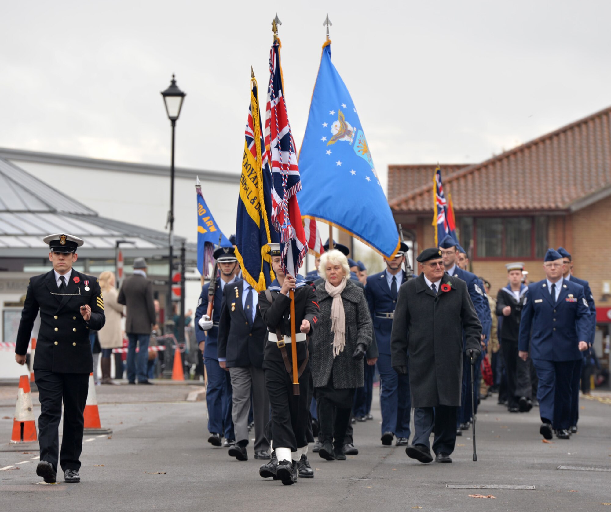 U.S. Air Force Airmen from the 100th Maintenance Group take part in a Remembrance Day parade Nov. 8, 2015, in Mildenhall, Suffolk, England. Remembrance Day is observed annually in November and commemorates the sacrifices of service members for all armed conflicts past and present. (U.S. Air Force photo by Karen Abeyasekere/Released)
