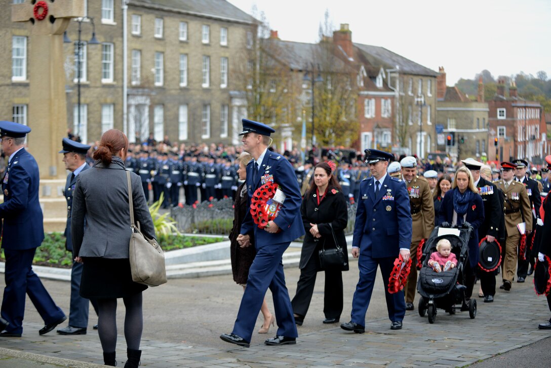 U.S. Air Force Col. John Howard, center with wreath, 100th Air Refueling Wing vice commander, participates in a Remembrance Day ceremony Nov. 8, 2015, with other Airmen from Team Mildenhall, in Bury St. Edmunds, England. Remembrance Day is held annually in November to honor members of the armed forces who have died in the line of duty. (U.S. Air Force photo by Staff Sgt. Richard Ware/Released)