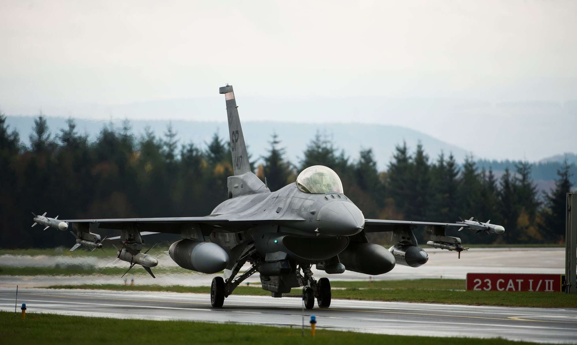 A U.S. Air Force pilot assigned to the 480th Fighter Squadron taxis a U.S. Air Force F-16 Fighting Falcon fighter aircraft on the flight line, Nov. 6, 2015, at Spangdahlem Air Base, Germany. Trident Juncture 2015, serves as a multiservice, multinational exercise geared at demonstrating NATO's ability to respond to large-scale crises. (U.S. Air Force photo by Staff Sgt. Christopher Ruano/Released)