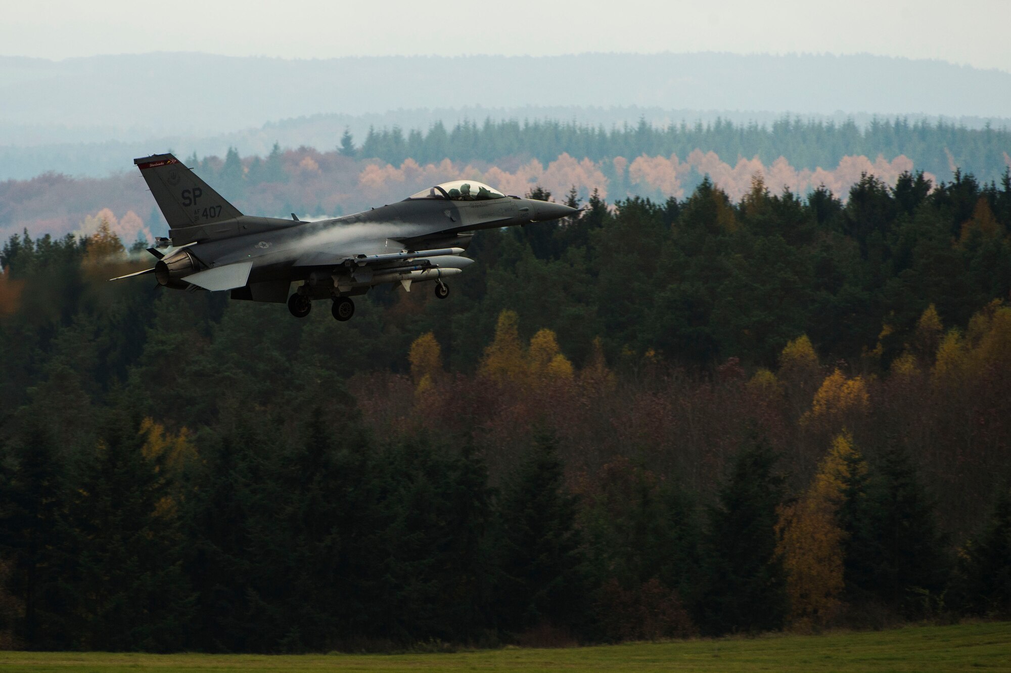 A U.S. Air Force pilot assigned to the 480th Fighter Squadron prepares to land an U.S. Air Force F-16 Fighting Falcon fighter aircraft Nov. 6, 2015, at Spangdahlem Air Base, Germany. The F-16s return from Trident Juncture, an annual NATO response force certification exercise. (U.S. Air Force photo by Staff Sgt. Christopher Ruano/Released)