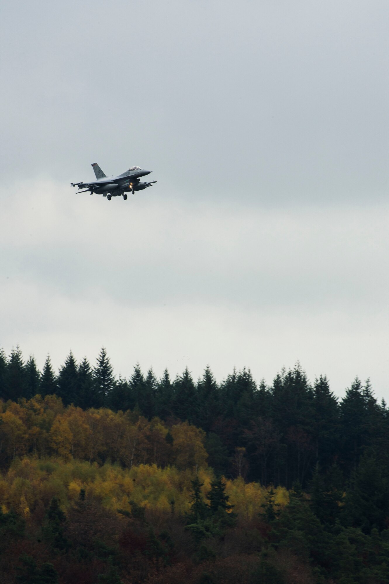 A U.S. Air Force pilot assigned to the 480th Fighter Squadron prepares to land an U.S. Air Force F-16 Fighting Falcon fighter aircraft Nov. 6, 2015, at Spangdahlem Air Base, Germany. The 480th FS deployed five F-16s and approximately 130 Airmen to Beja Air Base, Portugal, in support of Trident Juncture 2015, the largest NATO exercise conducted in the past 20 years. (U.S. Air Force photo by Staff Sgt. Christopher Ruano/Released)