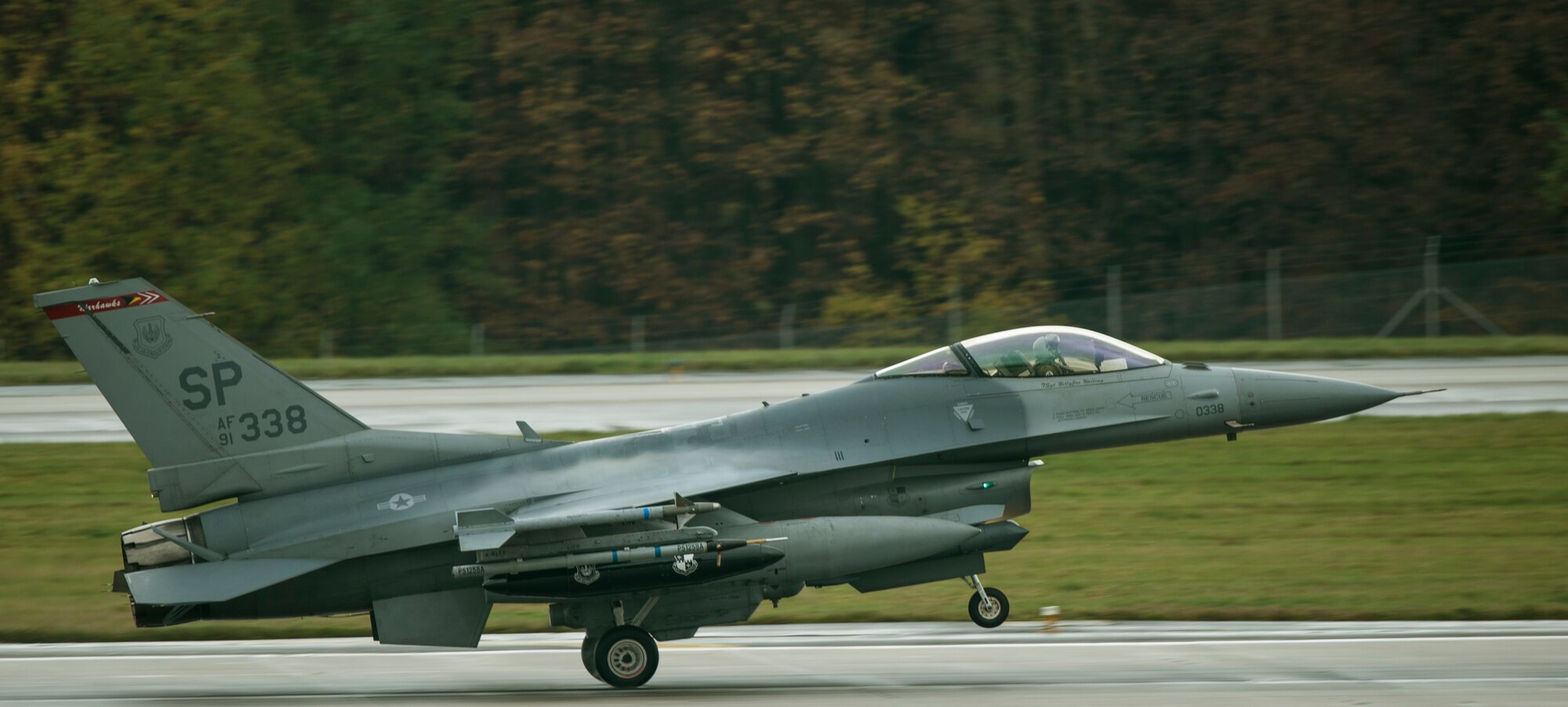 A U.S. Air Force pilot assigned to the 480th Fighter Squadron lands a U.S. Air Force F-16 Fighting Falcon fighter aircraft on the runway Nov. 6, 2015, at Spangdahlem Air Base, Germany. The 480th FS deployed five F-16s and approximately 130 personnel to support Trident Juncture. (U.S. Air Force photo by Senior Airman Rusty Frank/Released)