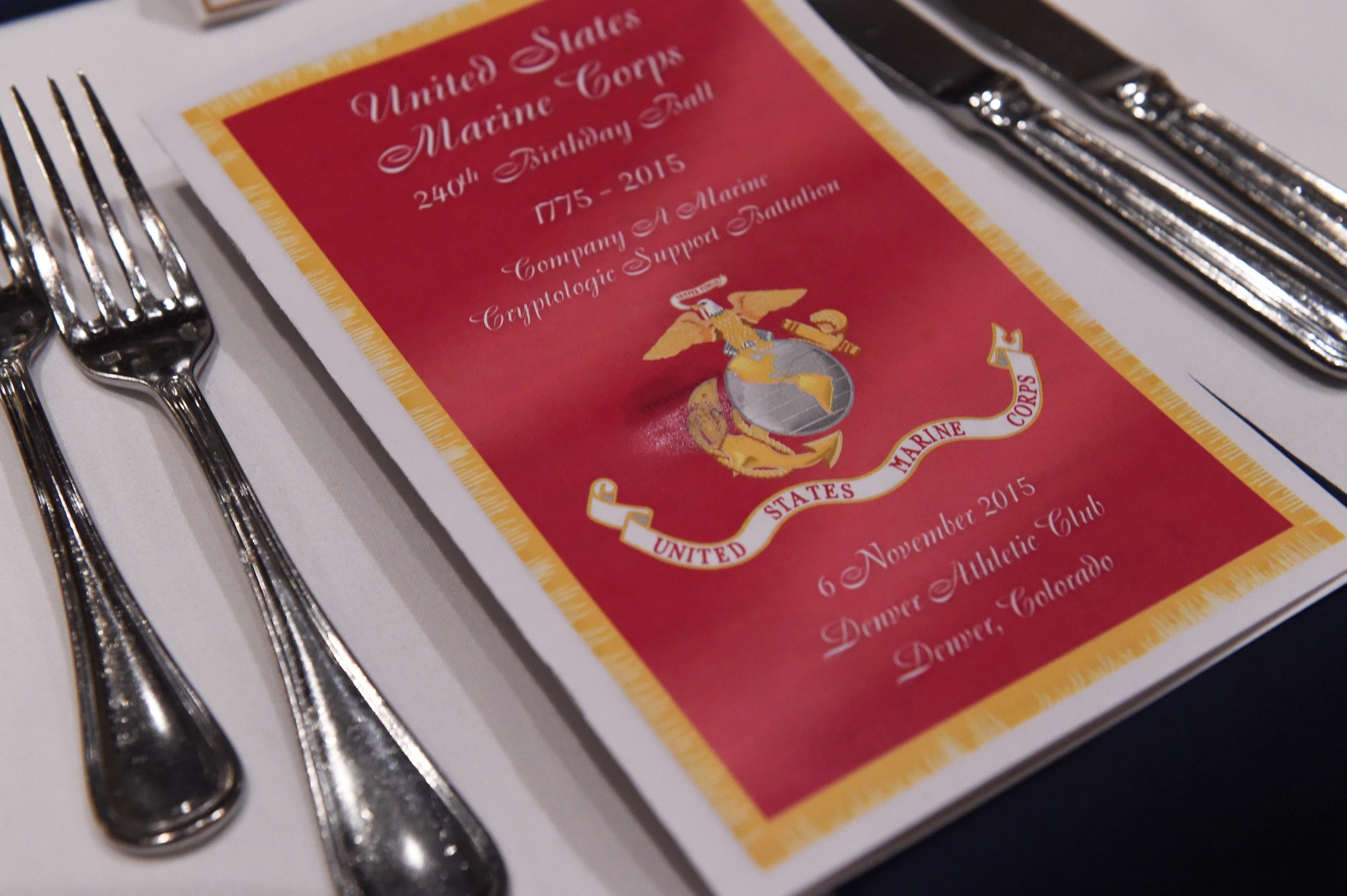 A U.S. Marine Corps 240th Birthday Ball pamphlet is placed at every seat during the Marine Corps Birthday Ball Nov. 6, 2015, at the at the Denver Athletic Club, Denver. The ball was held in honor of the Marine Corps’ 240th birthday, complete with a guest speaker, dinner and dancing. (U.S. Air Force photo by Airman 1st Class Samantha Meadors/Released)