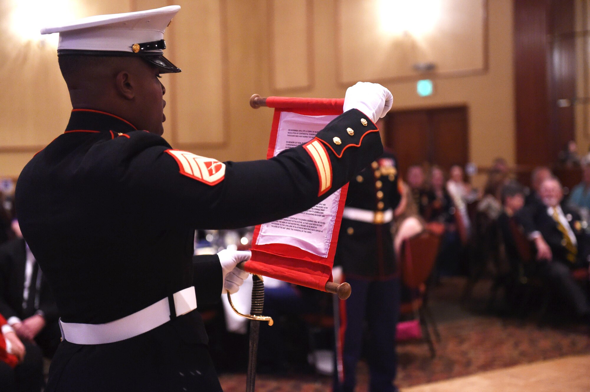 A member of the Company A, Marine Cryptologic Support Battalion reads Lt. Gen. John Lejeune’s birthday message during the Marine Corps Birthday Ball Nov. 6, 2015, at the Denver Athletic Club, Denver.  Lejeune, 13th Commandant of the U.S. Marine Corps, ordered the message be read every year during the Marine Corps birthday to honor the history, mission and tradition of the Corps. (U.S. Air Force photo by Airman 1st Class Samantha Meadors/Released)