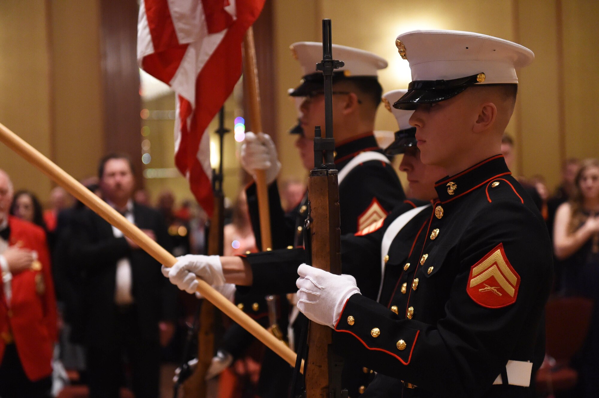 The colors are presented during the Marine Corps Birthday Ball, hosted by Company A, Marine Cryptologic Support Battalion, Nov. 6, 2015, at the at the Denver Athletic Club, Denver. The ball was held in honor of the Marine Corps’ 240th birthday, complete with a guest speaker, dinner and dancing. (U.S. Air Force photo by Airman 1st Class Samantha Meadors/Released)