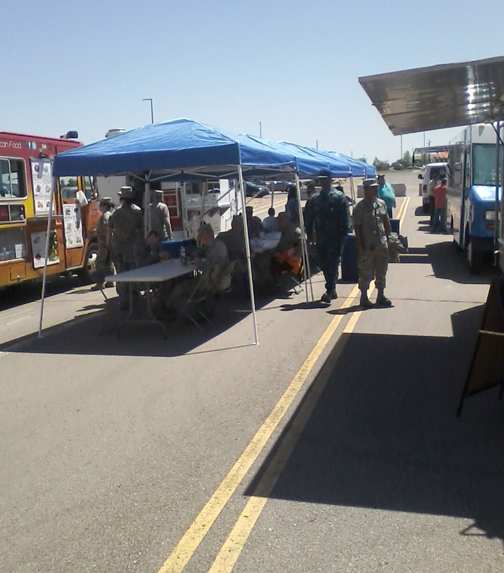 Buckley personnel use options provided by the food trucks for lunch June 17, 2015, on Buckley Air Force Base, Colo.  Food trucks bring more food options for Buckley personnel and are accessible when The Exchange is closed. (Courtesy photo)
