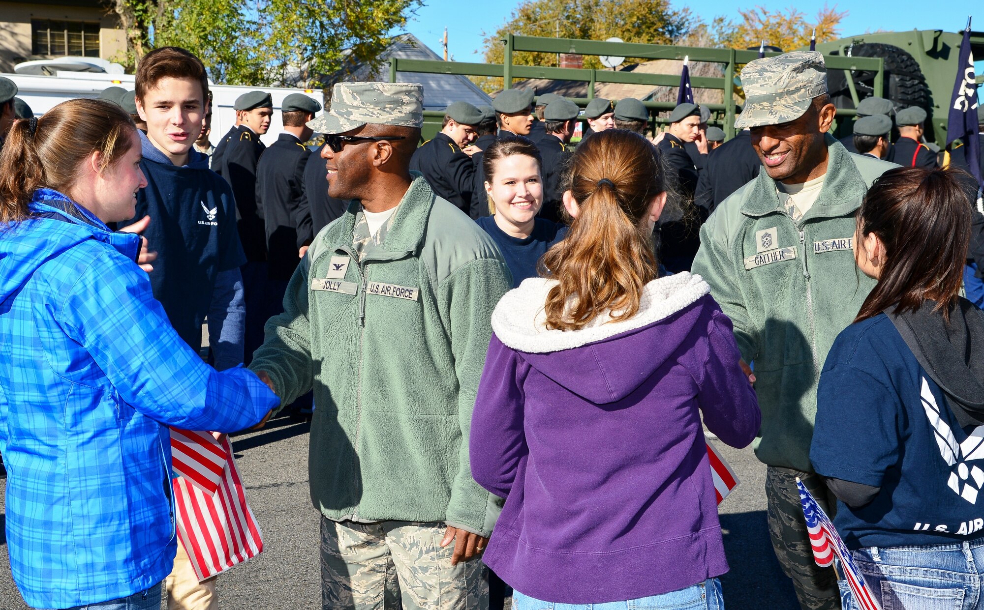Col. Ron Jolly, 75th Air Base Wing commander, and Chief Master Sgt. Rodney Gaither, 75th Air Base Wing command chief, shake hands with Air Force recruits prior to the annual Veterans Day parade in Ogden, Utah, Nov. 7, 2015. The parade procession began sharply at 11:11 a.m. in recognition of the armistice, or temporary cessation of hostilities, that went into effect during World War I on the 11th hour of the 11th day of the 11th month in 1918. World War I officially ended seven months later when the Treaty of Versailles was signed on June 28, 1919. (U.S. Air Force photo by R. Nial Bradshaw/Released)
