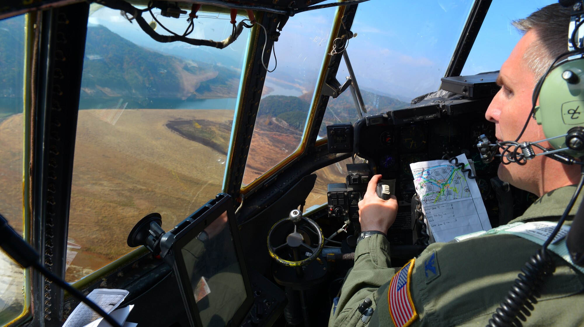 Col. Douglas DeLaMater, 374th Airlift Wing commander, pilots a C-130 Hercules over Japan, Nov. 5, 2015. DeLaMater participated in a pallet drop as part of the Wing’s participation in Exercise VIGILANT ACE 16, a U.S.-Republic of Korea combined exercise aimed at enhancing operational and tactical level coordination through combined and joint combat training. During the deployment phase of the exercise, the 374 AW conducted 42 missions, generated 87 sorties, totaling over 250 flying hours, and moved more than 400 thousand pounds and more than 650 passengers.(U.S. Air Force photo by Airman 1st Class Baker/Released)