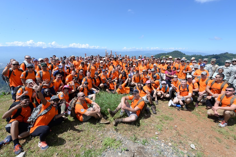 U.S. military members and civilians based out of Soto Cano Air Base, Honduras, hike food and supplies to those in need at Las Moras, Comayagua, during Chapel Hike 64, Oct. 31, 2015. Chapel Hikes take place every six weeks and provide community outreach by bringing much needed food and supplies to the less fortunate. (U.S. Air Force photo by Senior Airman Westin Warburton/Released)