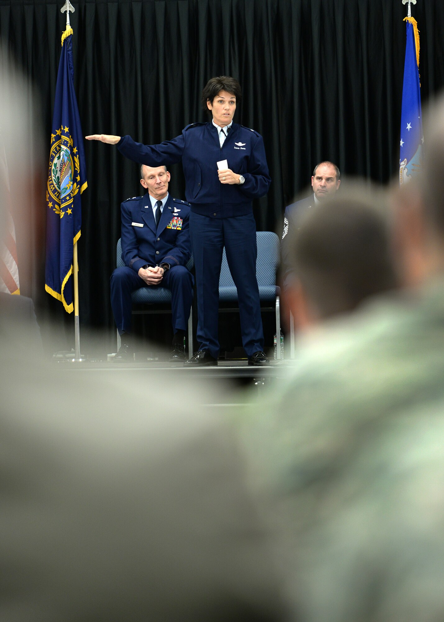 Longtime member of the New Hampshire Air National Guard, Brig. Gen. Laurie Farris speaks to those attending her promotion ceremony in Hangar 254 on base Nov. 7. In her new position as the N.H. ANG chief of staff, Farris will be responsible for the direction and coordination of staff activities for Joint Force Headquarters. (U.S. Air National Guard photo by Senior Airman Kayla McWalter)