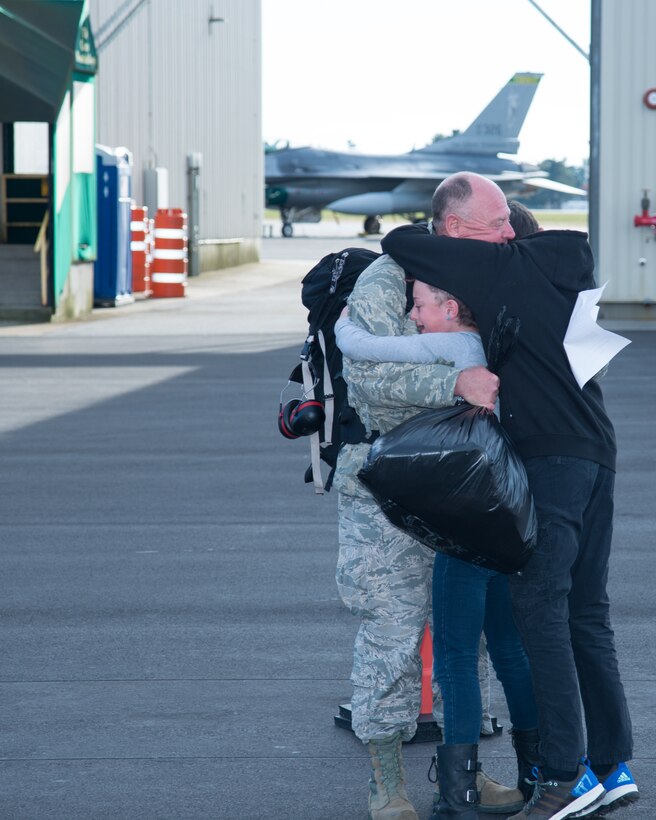 U.S. Air Force Master Sgt. John Kirkpatrick, from the 158th Fighter Wing, returns to his family at Vermont Air National Guard Base after a four-month long deployment to the Pacific, Oct. 19, 2015. Theater Security Packages to the Asian-Pacific show the U.S. commitment to the regional security and stability for disaster relief, global situational awareness, combating piracy, active defense and power projection. (U.S. Air National Guard photo by Master Sgt. Dan DiPietro)