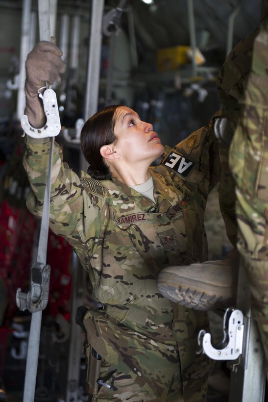 U.S. Air Force Staff Sgt. Angelica Ramirez prepares a C-130 Hercules aircraft for litters during a medevac mission on Bagram Airfield, Afghanistan, Nov. 6, 2015. Ramirez is a medical technician assigned to the 455th Expeditionary Aeromedical Evacuation Squadron. U.S. Air Force photo by Tech. Sgt. Robert Cloys