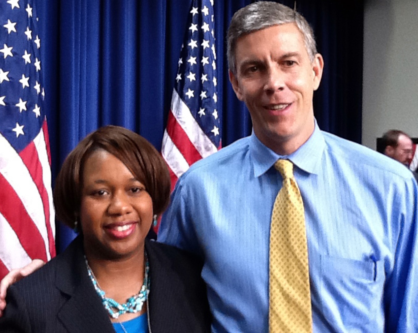 Army National Guard Lt. Col. Evet Jefferson, of the South Carolina National Guard, poses with Secretary of Education Arne Duncan at the White House in Washington, D.C., Dec. 7, 2011, as part of a ceremony recognizing teachers who recently achieved National Board Certification. Jefferson is a high school teacher in Columbia, S.C., and serves in the mobilization section at the Joint Forces Headquarters for her military drill weekends, also in Columbia.