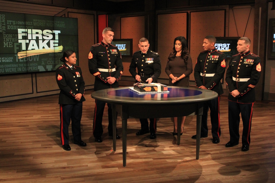1st Lt. Stefan Milan, center left, explains the Marine Corps Birthday Cake Cutting Ceremony on ESPN First Take to Molly Qerim, Nov. 5. The Marines, all from Marine Recruiting Station Springfield, 1st Marine Corps District, appeared on the show in light of the Marine Corps’ 240th birthday taking place on Nov. 10. (Official Marine Corps Photo by Staff Sgt. Richard Blumenstein) 
