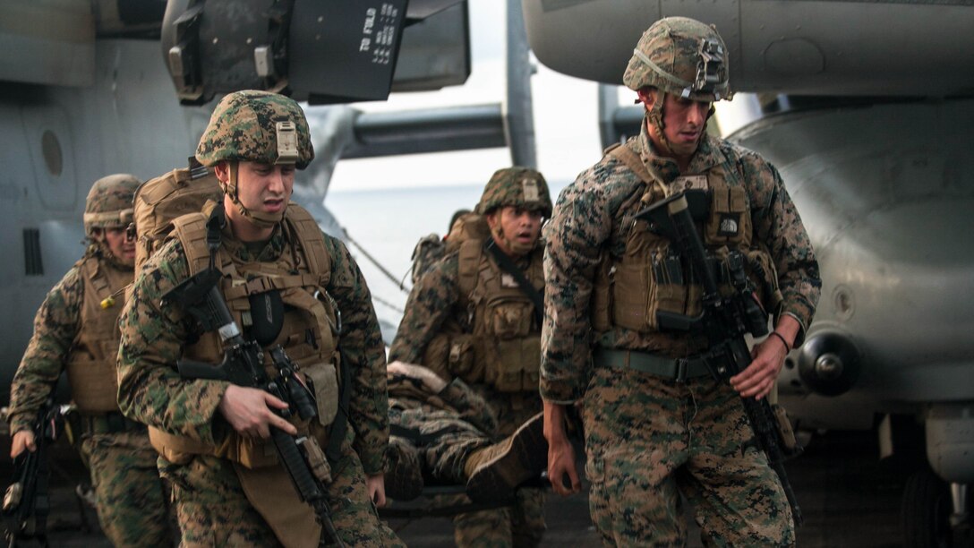 Marines and sailors with the 15th Marine Expeditionary Unit transport a simulated causality during a mass-casualty drill on the flight deck of the USS Essex (LHD 2).The Marines and Sailors honed their skills to become quicker and more efficient should a situation arise where medical attention is needed. The 15th MEU is currently deployed in the Indo-Asia-Pacific region to promote regional stability and security in the U.S. 7th Fleet area of operations.