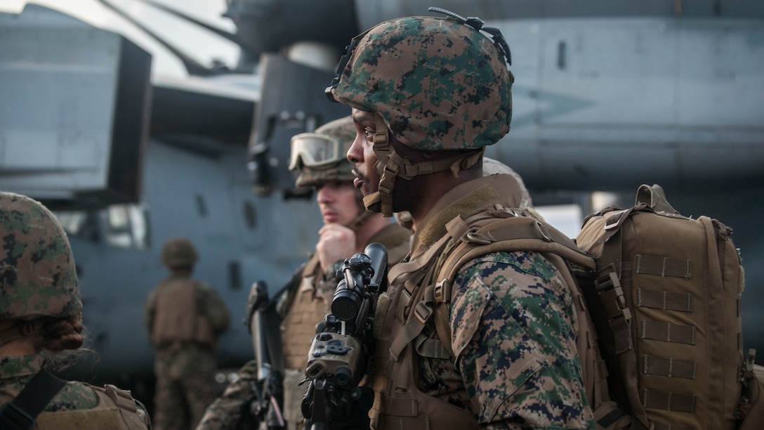 Marines and sailors with the 15th Marine Expeditionary Unit wait for directions during a mass-casualty drill on the flight deck of the USS Essex (LHD 2).The Marines and Sailors honed their skills to become quicker and more efficient should a situation arise where medical attention is needed. The 15th MEU is currently deployed in the Indo-Asia-Pacific region to promote regional stability and security in the U.S. 7th Fleet area of operations. 