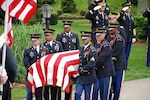 The flag-covered casket of New York Army National Guard 1st Lt. Joseph Theinert, is carried by members of the New York Military Forces Honor Guard on June, 11, 2010. The New York Military Forces Honor Guard expects to perform more than 10,600 military funerals, mostly for World War II veterans, in 2011.