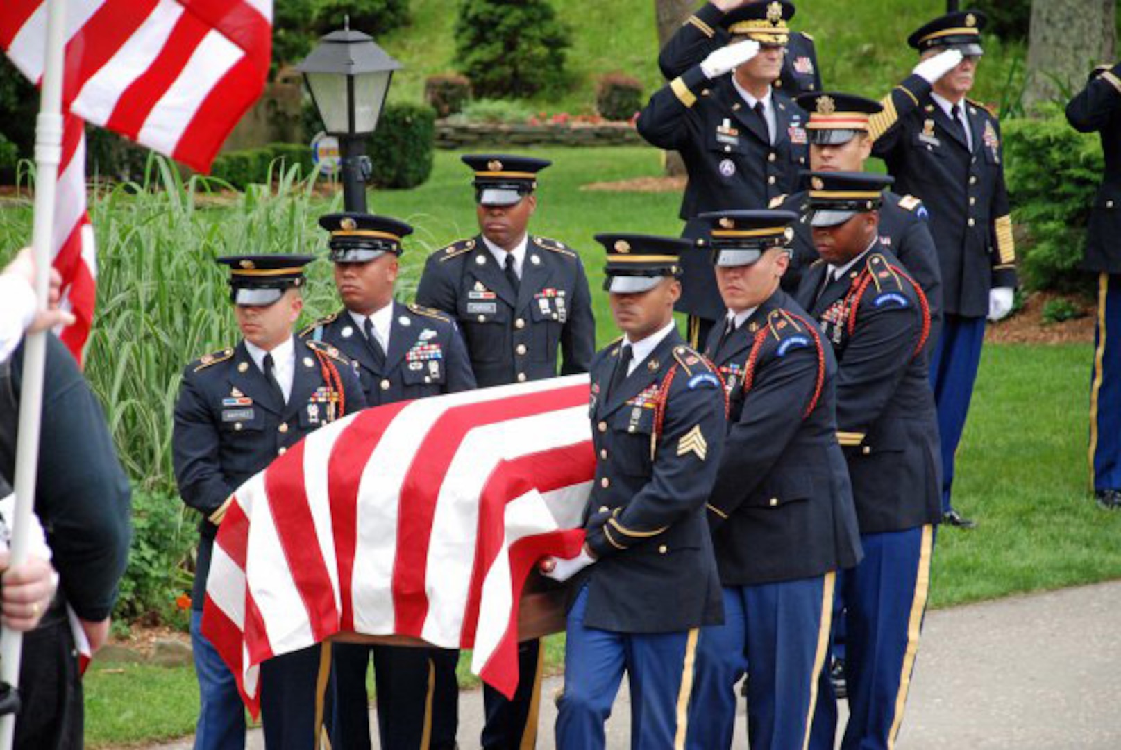 The flag-covered casket of New York Army National Guard 1st Lt. Joseph Theinert, is carried by members of the New York Military Forces Honor Guard on June, 11, 2010. The New York Military Forces Honor Guard expects to perform more than 10,600 military funerals, mostly for World War II veterans, in 2011.