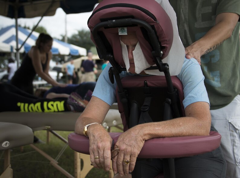 Pensacola school of therapy students give free massages during the Duke Field Wing Day event Nov. 7.  The 919th Special Operations Wing sets aside a special day each year to show appreciation for its reservists and their family members. Events included music, sports, children’s games, etc. (U.S. Air Force photo/Tech. Sgt. Jasmin Taylor)