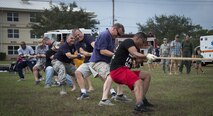 Members of the 919th Special Operations Wing give it their all in the final round of tug of war during the Duke Field Wing Day event Nov. 7.  The 919th SOW sets aside a special day each year to show appreciation for its reservists and their family members. Events included music, sports, children’s games, etc. (U.S. Air Force photo/Tech. Sgt. Jasmin Taylor)