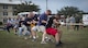 Members of the 919th Special Operations Wing give it their all in the final round of tug of war during the Duke Field Wing Day event Nov. 7.  The 919th SOW sets aside a special day each year to show appreciation for its reservists and their family members. Events included music, sports, children’s games, etc. (U.S. Air Force photo/Tech. Sgt. Jasmin Taylor)
