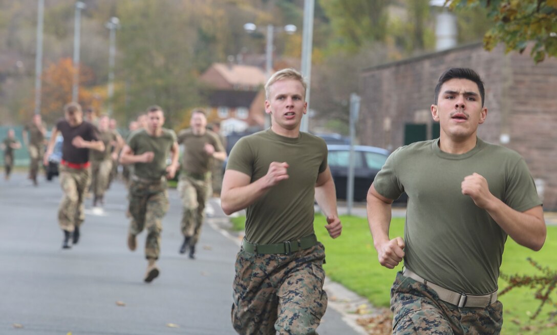 U.S. Marine Cpl. John Greenhaw, center, and Cpl. Gabriel Corral, right, race to finish the movement to contact portion of a combat fitness test during a competition with British soldiers in Edinburgh, U.K., Nov. 6, 2015. Both Marines are intelligence specialists with 2nd Intelligence Battalion. More than 60 Marines with the unit participated in Exercise Phoenix Odyssey II, which was designed to improve joint intelligence operations between the two forces. (U.S. Marine Corps photo by Cpl. Lucas Hopkins/Released)