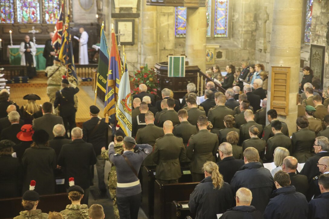 U.S. Marines with 2nd Intelligence Battalion and British service members and citizens gather for a Remembrance Day memorial service in Berwick-upon-Tweed, U.K., Nov. 8, 2015. Remembrance Day is a yearly holiday which commemorates service members who have sacrificed their lives in previous wars. (U.S. Marine Corps photo by Cpl. Lucas Hopkins/Released)