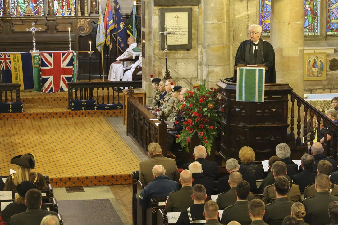 The Reverend Dr. Adam Hood addresses U.S. Marines with 2nd Intelligence Battalion and British service members and citizens at a Remembrance Day memorial service in Berwick-upon-Tweed, U.K., Nov. 8, 2015. The Marines marched with various British forces to commemorate the holiday, which honors fallen service members. (U.S. Marine Corps photo by Cpl. Lucas Hopkins/Released)