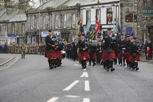 British service members and U.S. Marines with 2nd Intelligence Battalion march during a Remembrance Day Parade in Berwick-upon-Tweed, U.K., Nov. 8, 2015. The forces came together to commemorate service members who sacrificed their lives in war. (U.S. Marine Corps photo by Cpl. Lucas Hopkins/Released)