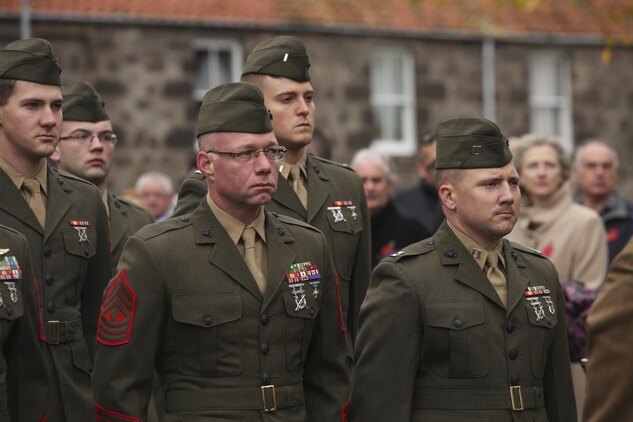 U.S. Marines with 2nd Intelligence Battalion stand at attention during a Remembrance Day Parade in Berwick-upon-Tweed, U.K., Nov. 8, 2015. The Marines gathered with various U.K. services to march in the parade, which commemorates service members who sacrificed their lives in war. (U.S. Marine Corps photo by Cpl. Lucas Hopkins/Released)