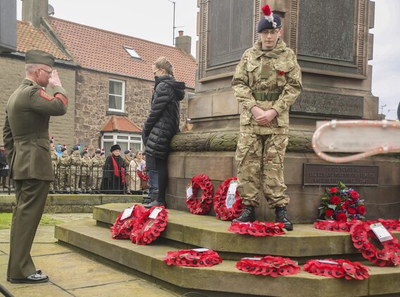 U.S. Marine First Sgt. Timothy Austin, left, the senior enlisted advisor of Exercise Phoenix Odyssey II, salutes a war memorial in Berwick-upon-Tweed, U.K., Nov. 8, 2015. Approximately 25 Marines marched alongside British service members during a Remembrance Day Parade, a holiday which commemorates service members who sacrificed their lives in war. The Marines concluded Exercise Phoenix Odyssey with British soldiers Nov. 6, which was designed to enhance joint intelligence operations. (U.S. Marine Corps photo by Cpl. Lucas Hopkins/Released)