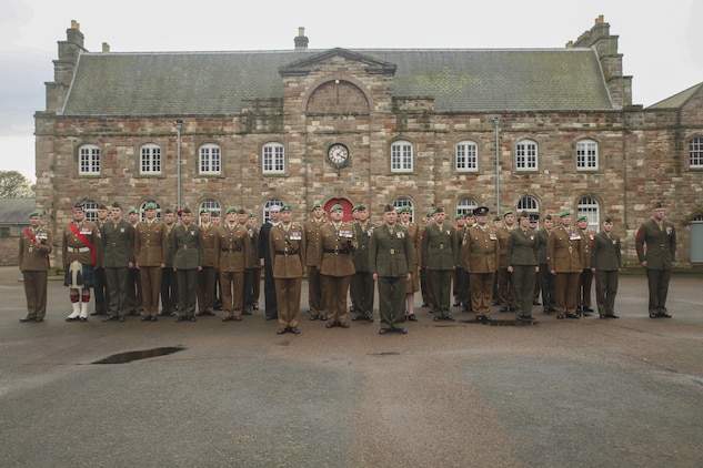 U.S. Marines with 2nd Intelligence Battalion pose for a photo with British soldiers following a Remembrance Day Parade in Berwick-upon-Tweed, U.K., Nov. 8, 2015. The Marines gathered with various British armed services to commemorate the holiday, which honors service members who sacrificed their lives in war. The forces concluded Exercise Phoenix Odyssey with British soldiers Nov. 6, which was designed to enhance joint intelligence operations. (U.S. Marine Corps photo by Cpl. Lucas Hopkins/Released)