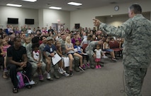 Col. James Phillips, 919th Special Operations Wing commander, talks to the new mock deplorer’s during the Duke Field Operation Hero event Nov. 7. The event was a mock deployment exercise for 919th SOW children. The exercise started with the kids receiving orders before deploying to the 919th Special Operations Logistics Readiness Squadron building. The “little deplorer’s” were issued fake military ID cards, dog tags, and immunizations. (U.S. Air Force photo/ Tech. Sgt. Jasmin Taylor)