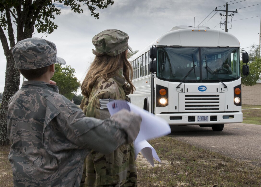 “Future Airmen” await their ride to the deployment line during the Duke Field Operation Hero event Nov. 7. The event was a mock deployment exercise for 919th Special Operations Wing children. The exercise started with the kids receiving orders before deploying to the 919th Special Operations Logistics Readiness Squadron building. The “little deployers” were issued fake military ID cards, dog tags, and immunizations. (U.S. Air Force photo/ Tech. Sgt. Jasmin Taylor) 