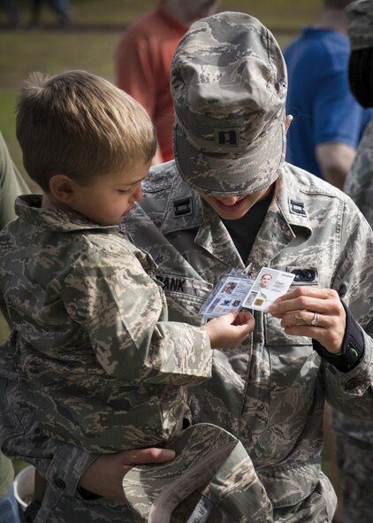 Matthew compares his id to his mother’s, Capt. Susan Frank, 919th Special Operation Logistics Readiness Squadron, during the Duke Field Operation Hero event Nov. 7. The event was a mock deployment exercise for 919th Special Operations Wing children. The exercise started with the kids receiving orders before deploying to the 919th SOLRS building. The “little deployers” were issued fake military ID cards, dog tags, and immunizations. (U.S. Air Force photo/ Tech. Sgt. Jasmin Taylor)