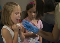 Bella Payne receives her immunizations during the Duke Field Operation Hero event Nov. 7. The event was a mock deployment exercise for 919th Special Operations Wing children. The exercise started with the kids receiving orders before deploying to the 919th Special Operations Logistics Readiness Squadron building. The “little deployers” were issued fake military ID cards, dog tags, and immunizations. (U.S. Air Force photo/ Tech. Sgt. Jasmin Taylor) 