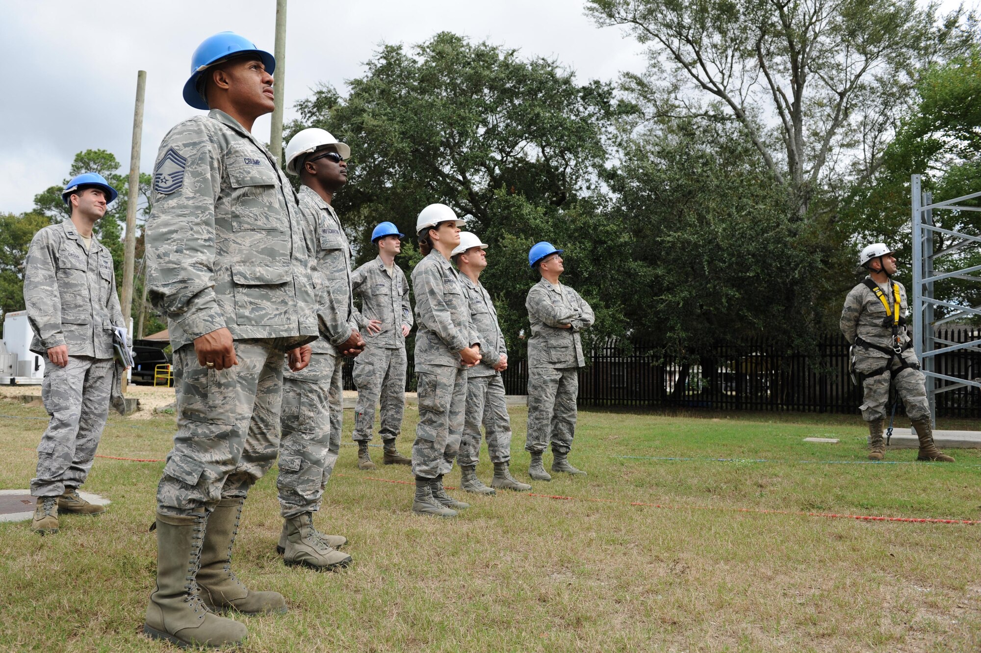 Base leadership watch a tower rescue demonstration by the 85th Engineering Installation Squadron during the 85th EIS open house for base leadership at Maltby Hall Nov. 3, 2015, Keesler Air Force Base, Miss. The open house also included a mission brief, a radiation hazards tour and an infrared camera demonstration. (U.S. Air Force photo by Kemberly Groue)