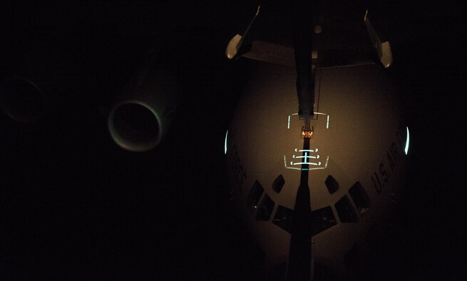 A C-17 Globemaster III receives fuel from a KC-10 Extender while flying over the Atlantic Ocean during Trident Juncture 2015, Nov. 3, 2015. Without the refueling capability of the KC-10, the C-17s would not have enough fuel to make it all the way to Spain from the United States. (U.S. Air Force photo/Staff Sgt. Douglas Ellis)