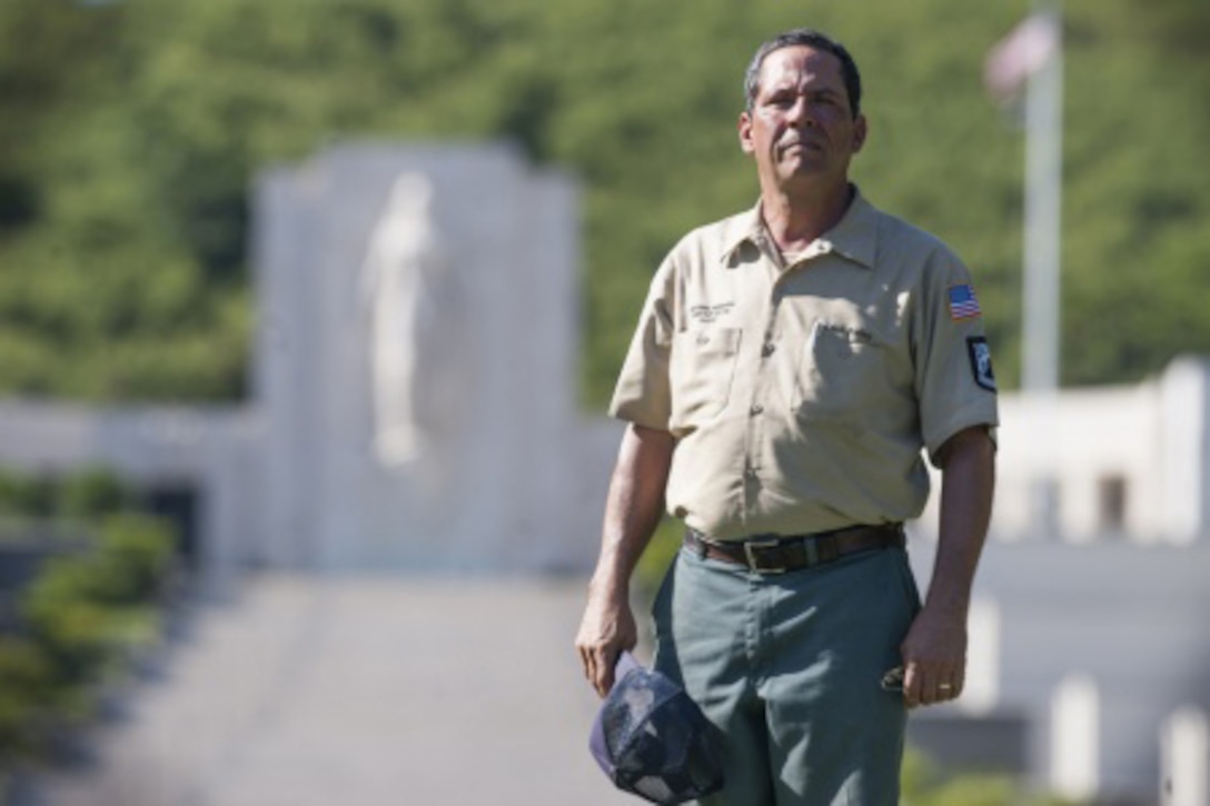 Chris Farley, U.S. Navy veteran and National Memorial Cemetery of the Pacific caretaker, poses for a photo at the NMCP in Honolulu, Oct. 28, 2015. Farley served from 1982 to 1987 as an air traffic controller. He is responsible for the maintenance of the 112.5 acres of land that make up the cemetery, the 56,971 gravesites of those who are interred in-ground or in-columbarium, and the 28,788 fallen who are memorialized in the courts of the missing. U.S. Air Force photo by Staff Sgt. Christopher Hubenthal